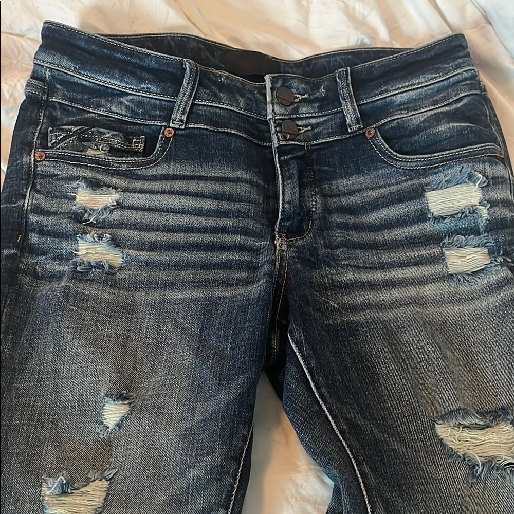 Buckle Black Distressed Blue Jeans